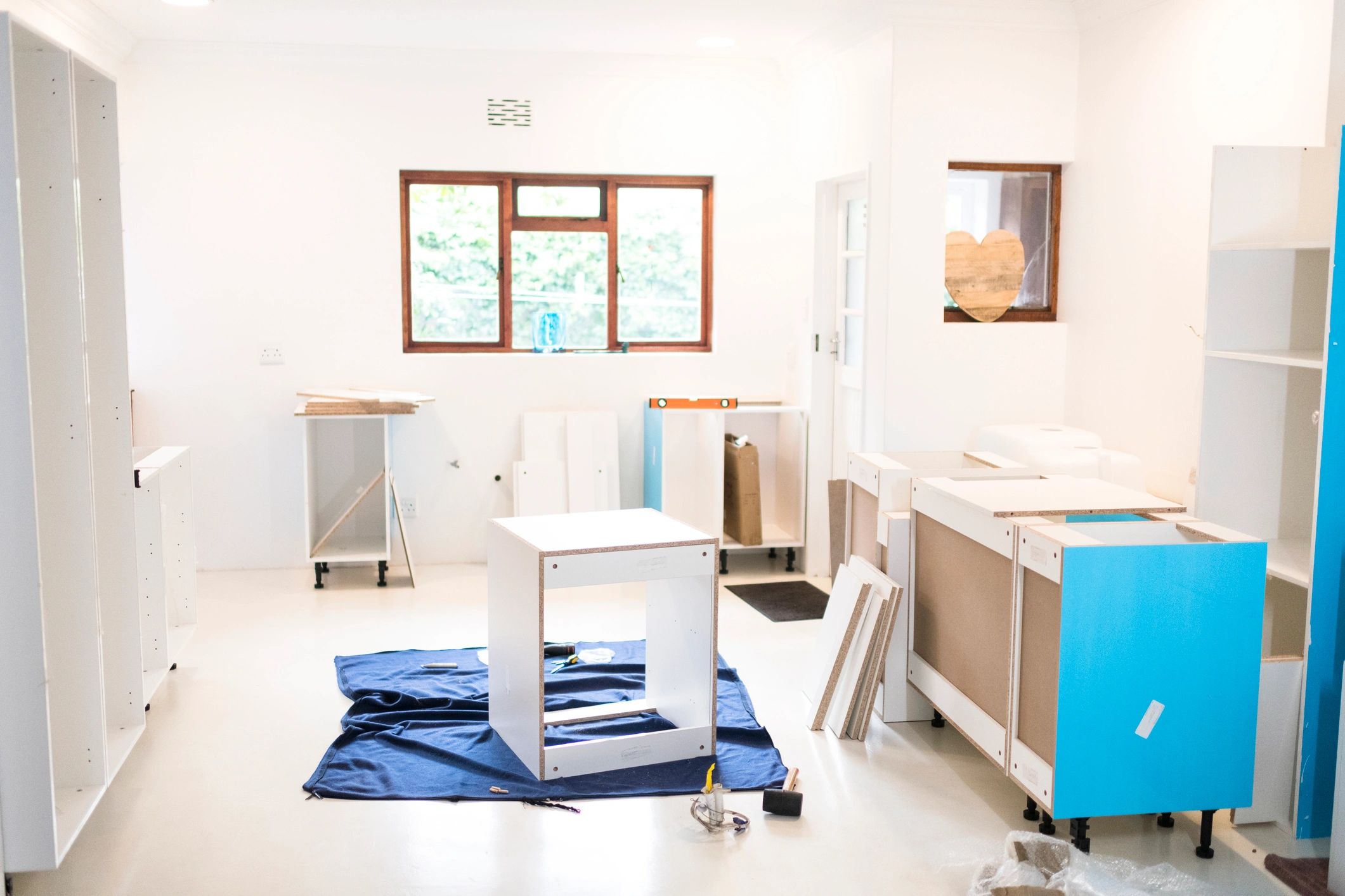 Kitchen cabinets being installed during a home improvement project