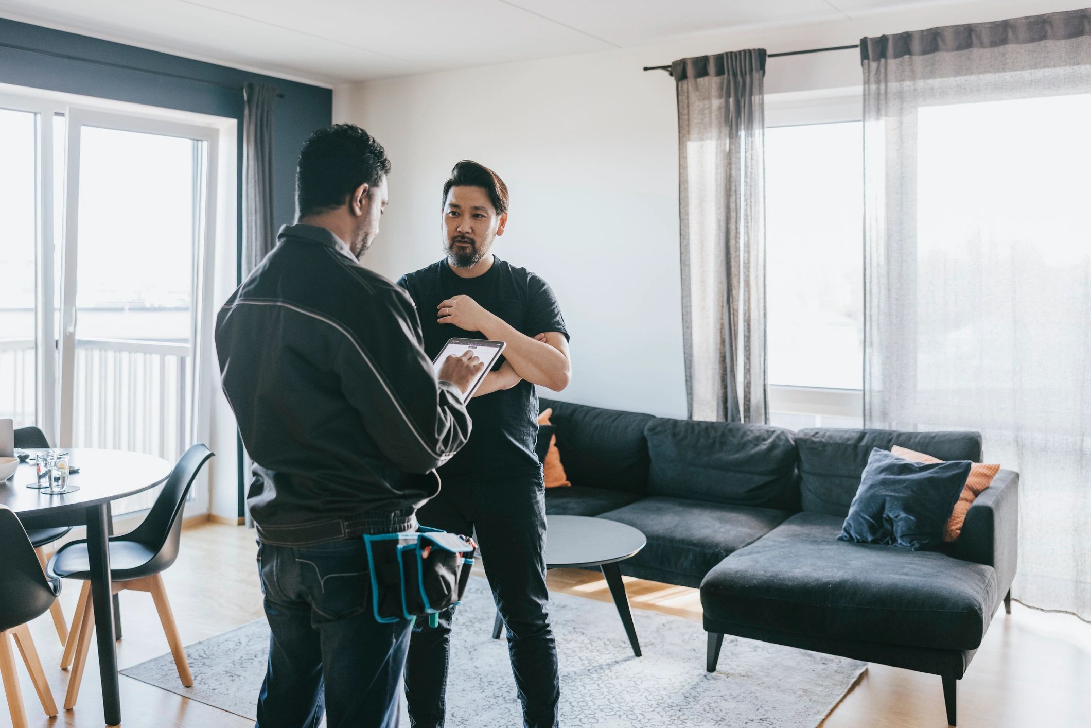 Home contractor consultation with homeowner