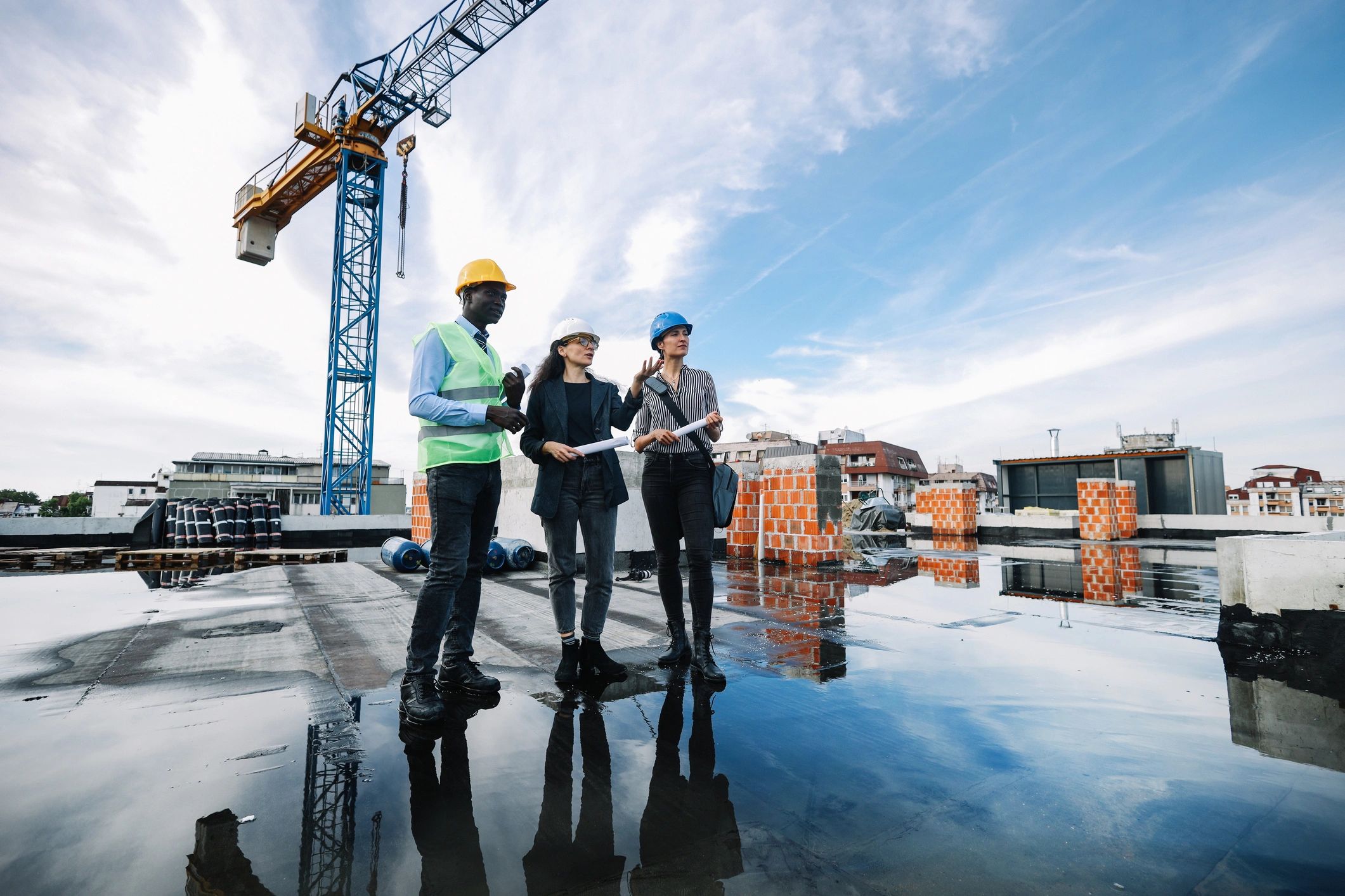 Construction professionals meeting at a building site