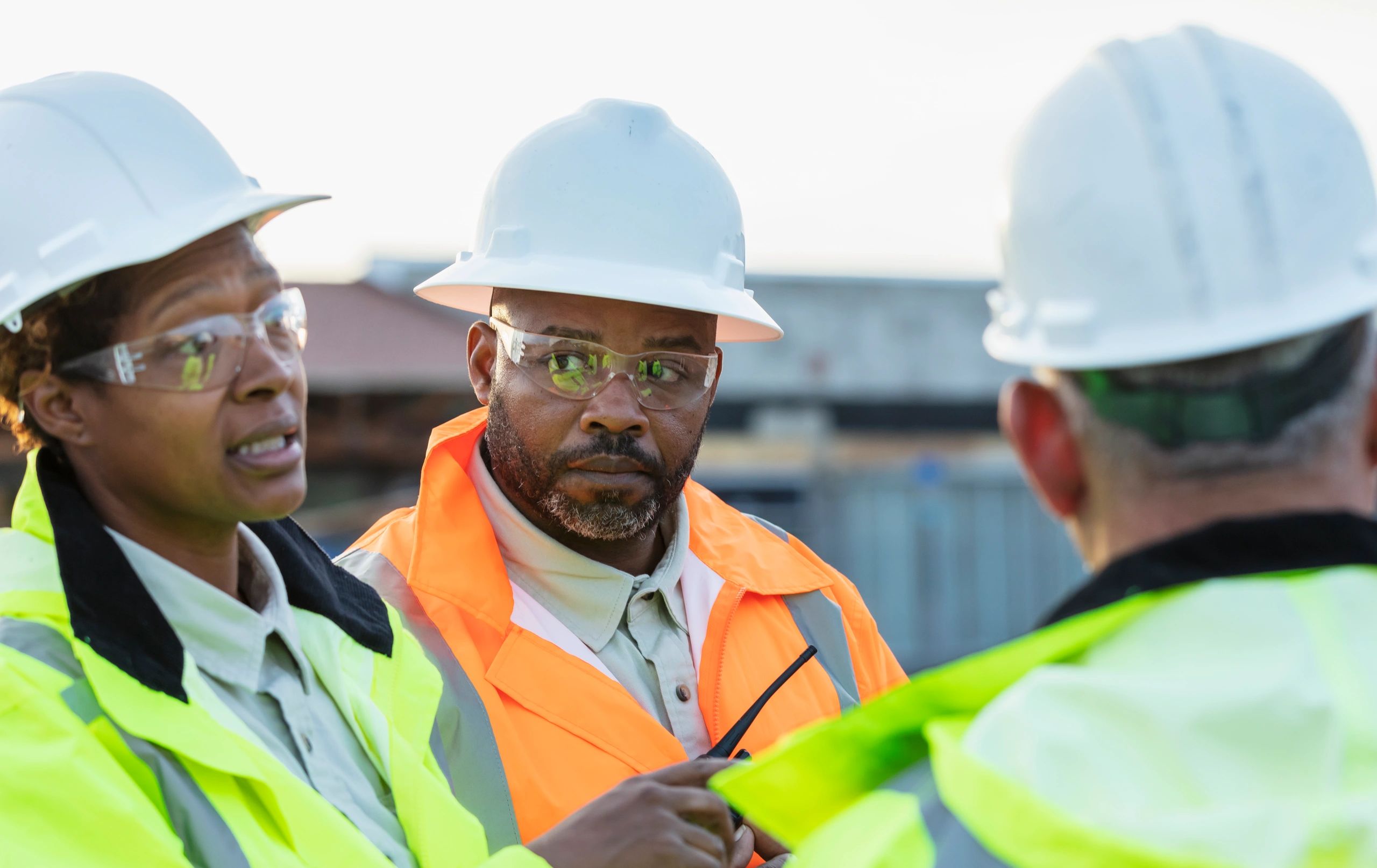 Construction team reviewing plans on site