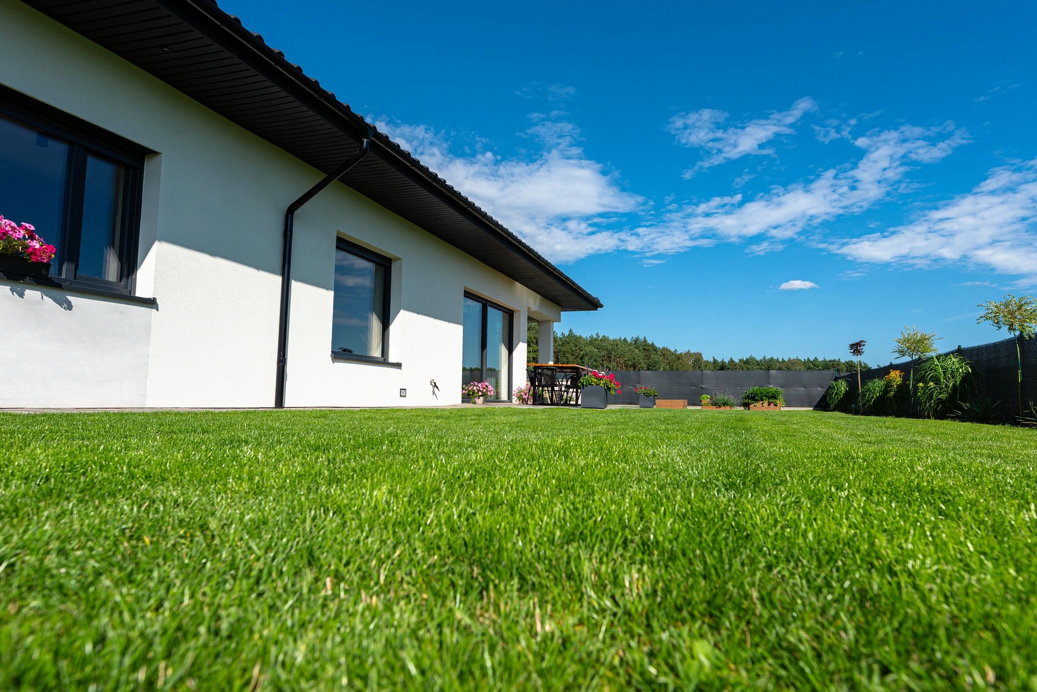 Energy efficient home exterior with landscaped yard