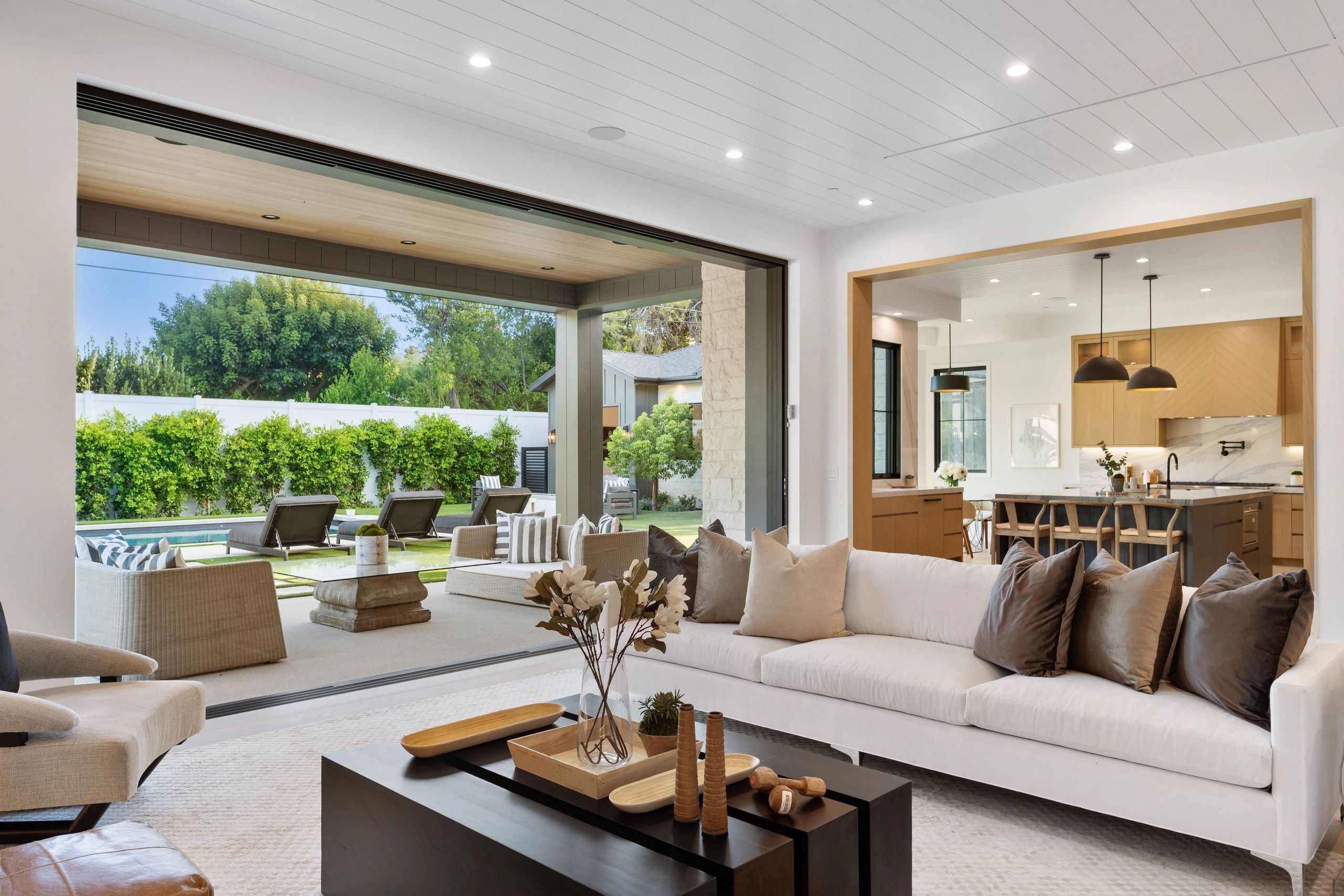 Modern home opening to a patio and outdoor living area
