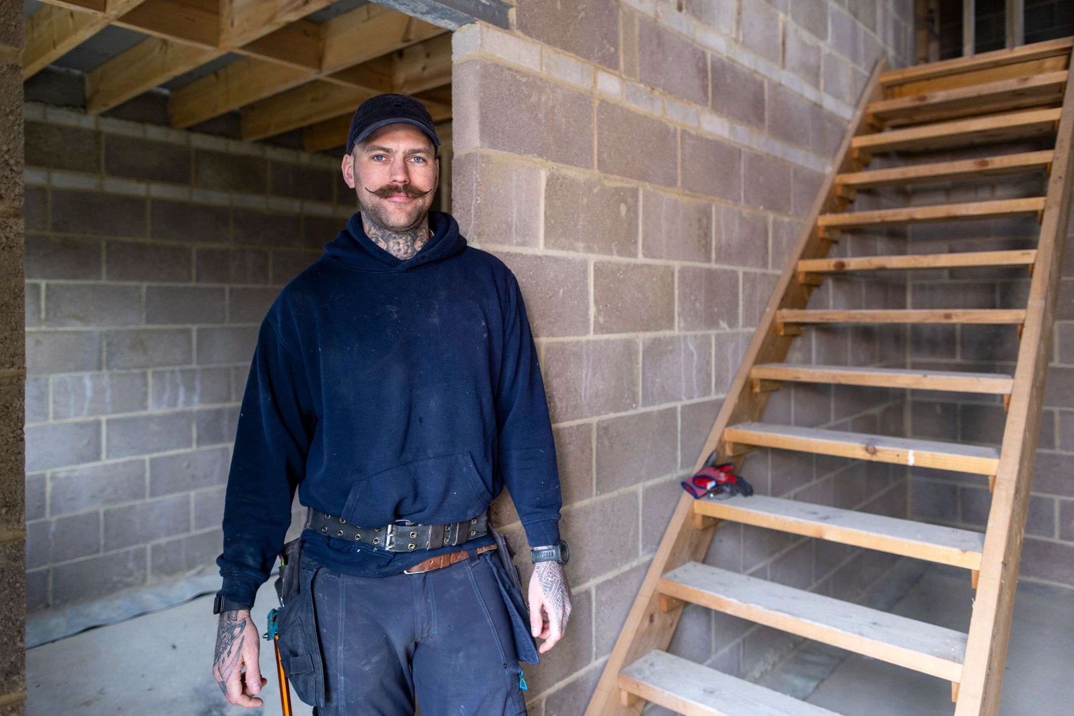 Technician reviewing work at a home project site