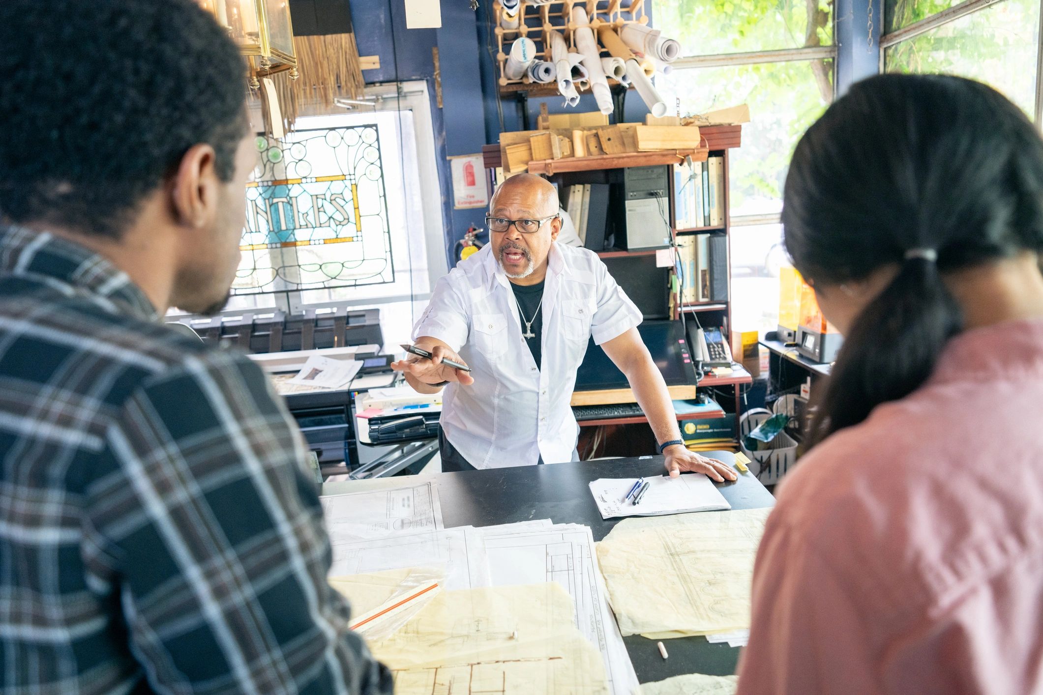 Home improvement team reviewing renovation plans