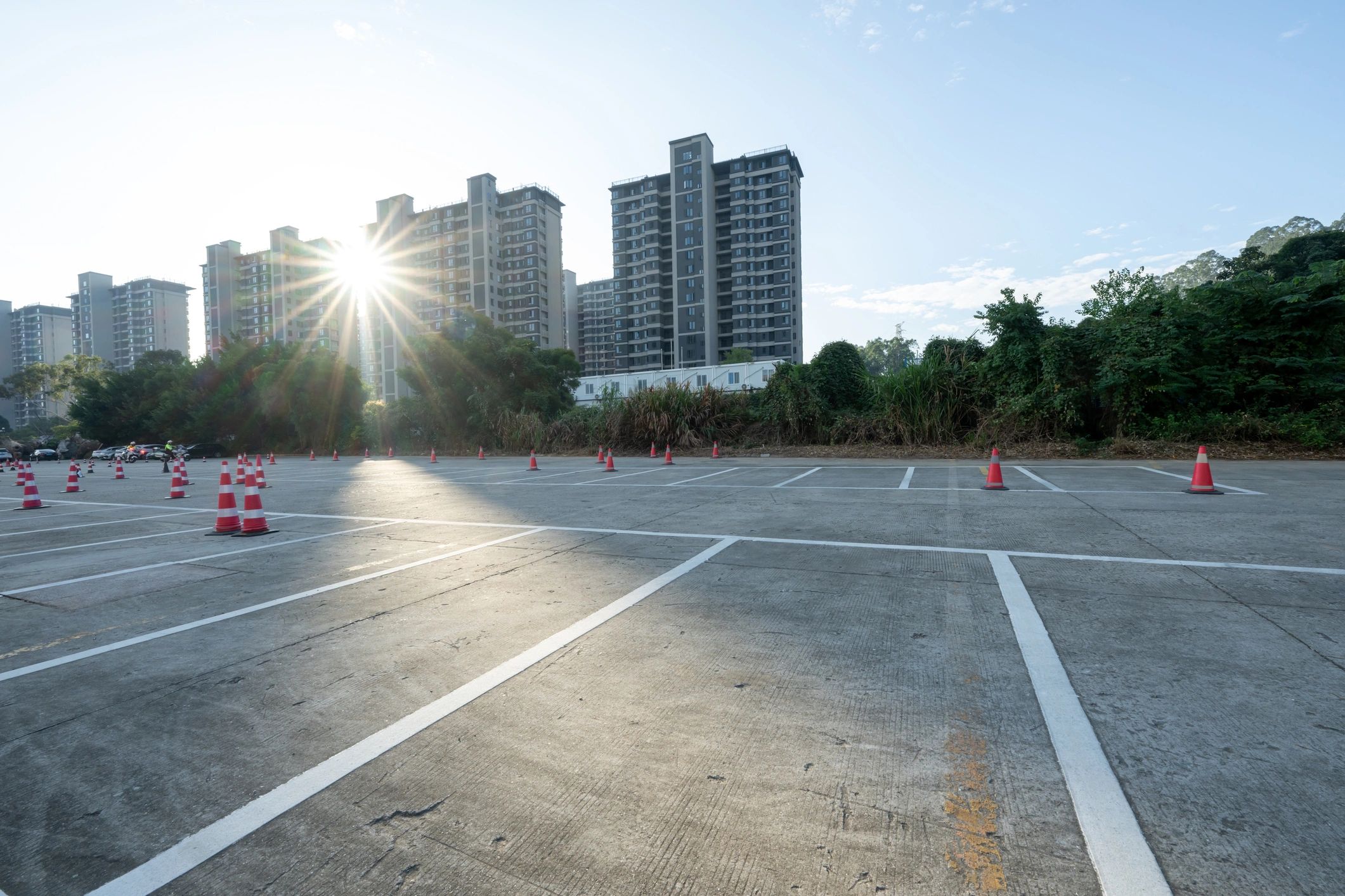 Wide paved access area showing open vehicle space