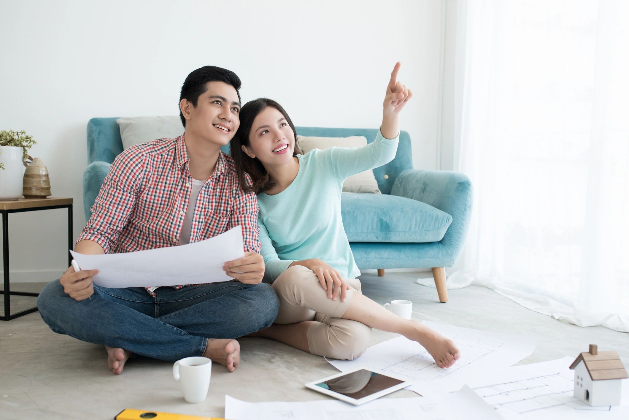 Homeowners reviewing renovation plans together
